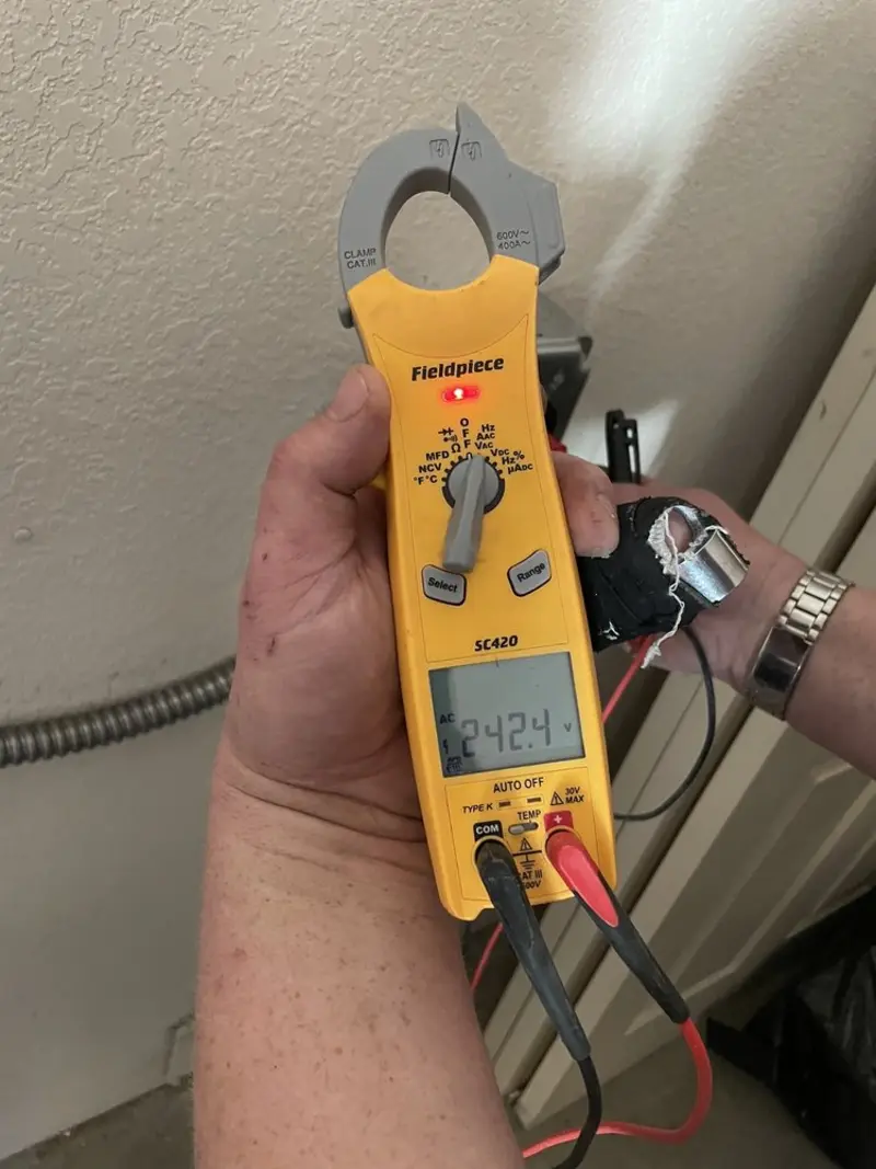Voltage testing with clamp meter during Electrical Installation Services in Montebello